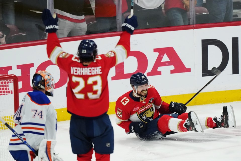 Florida Panthers' Sam Reinhart (13) celebrates his goal against Edmonton Oilers goalie Stuart Skinner (74) as Panthers' Carter Verhaeghe (23) reacts during the first period in Game 6 of the Stanley Cup final in Sunrise, Fla., on Tuesday, June 17, 2025. THE CANADIAN PRESS/Nathan Denette
