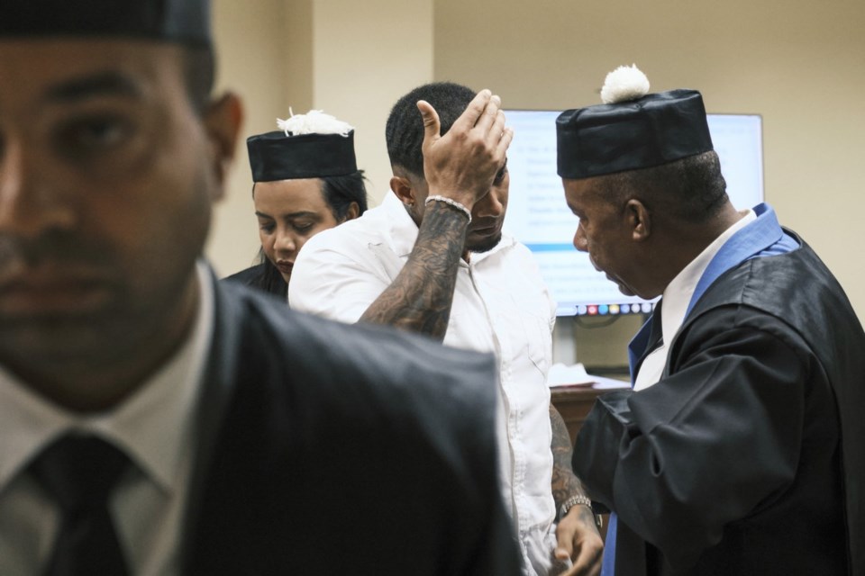 Tampa Bay Rays shortstop Wander Franco talks to his lawyer Teodosio Jaquez during his trial on charges of sexually abusing a minor in Puerto Plata, Dominican Republic, Monday, June 2, 2025. (AP Photo/Ricardo Hernandez)