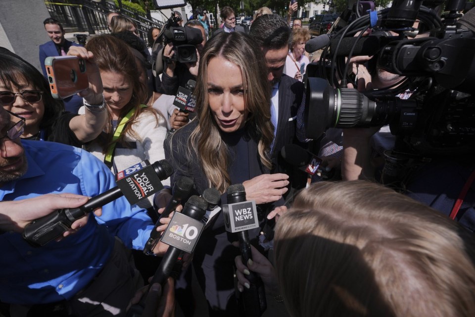 Karen Read is surrounded by media while departing with her attorney Alan Jackson as the jury deliberates at her trial at Norfolk Superior Court, Monday, June 16, 2025, in Dedham, Mass. (AP Photo/Charles Krupa)