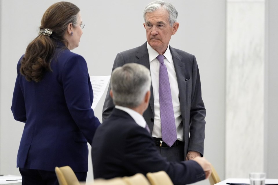 Federal Reserve Chairman Jerome Powell, right, stands before speaking at the 75th anniversary conference of the Federal Reserve Board's International Finance Division at the Federal Reserve in Washington, Monday, June 2, 2025. (AP Photo/Mark Schiefelbein)