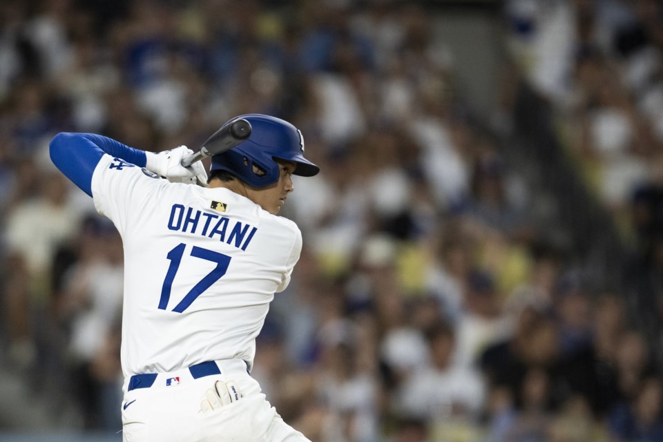 Los Angeles Dodgers' Shohei Ohtani steps up to the bat during the sixth inning of a baseball game against the San Diego Padres, in Los Angeles, Monday, June 16, 2025. (AP Photo/Kyusung Gong)