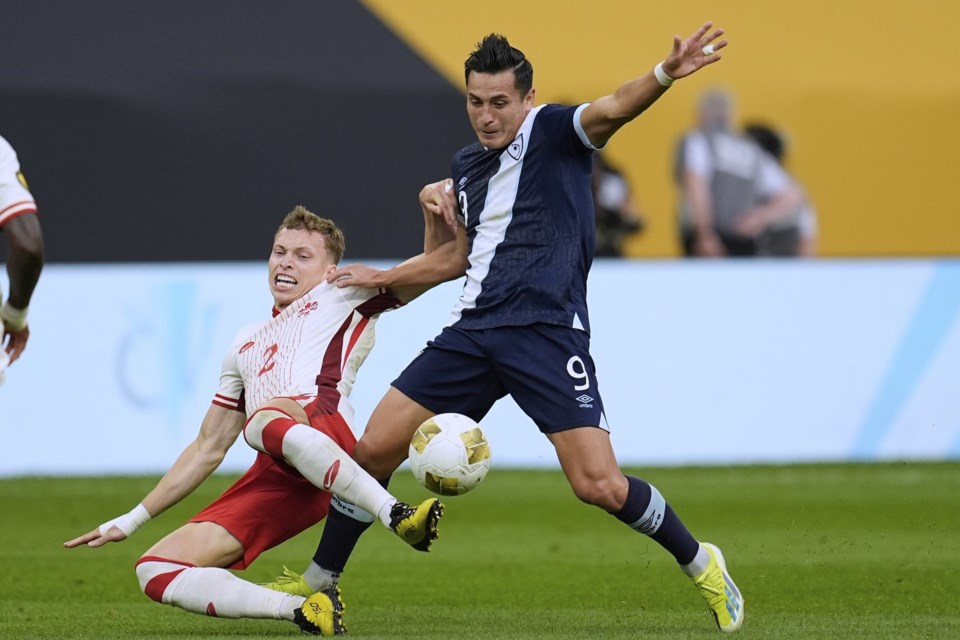 Canada defender Alistair Johnston (2) and Guatemala forward Rubio Mendez (9) battle for possession of the ball during the first half of a CONCACAF Gold Cup quarterfinals soccer match Sunday, June 29, 2025, in Minneapolis. THE CANADIAN PRESS/AP-Abbie Parr