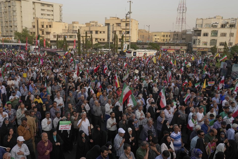 Iranian protesters attend an anti-U.S. and anti-Israeli rally at Enqelab-e-Eslami (Islamic Revolution) square in downtown Tehran, Iran, Tuesday, June 24, 2025. (AP Photo/Vahid Salemi)