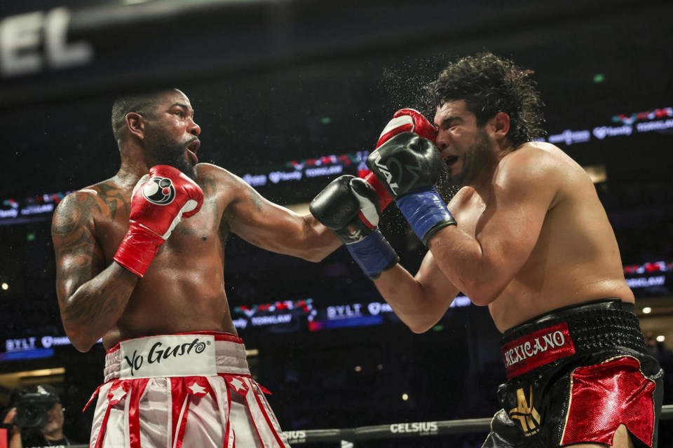 Yuniel Dorticos, left, punches Gilberto Ramirez during their WBA and WBO cruiserweight titles boxing match on Saturday, June 28, 2025, in Anaheim, Calif. (AP Photo/Etienne Laurent)