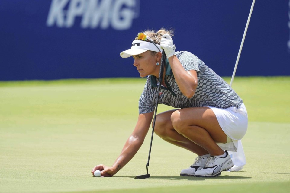 Lexi Thompson lines up a putt on the 18th hole during the second round of the Women's PGA Championship golf tournament Friday, June 20, 2025, in Frisco, Texas. (AP Photo/LM Otero)