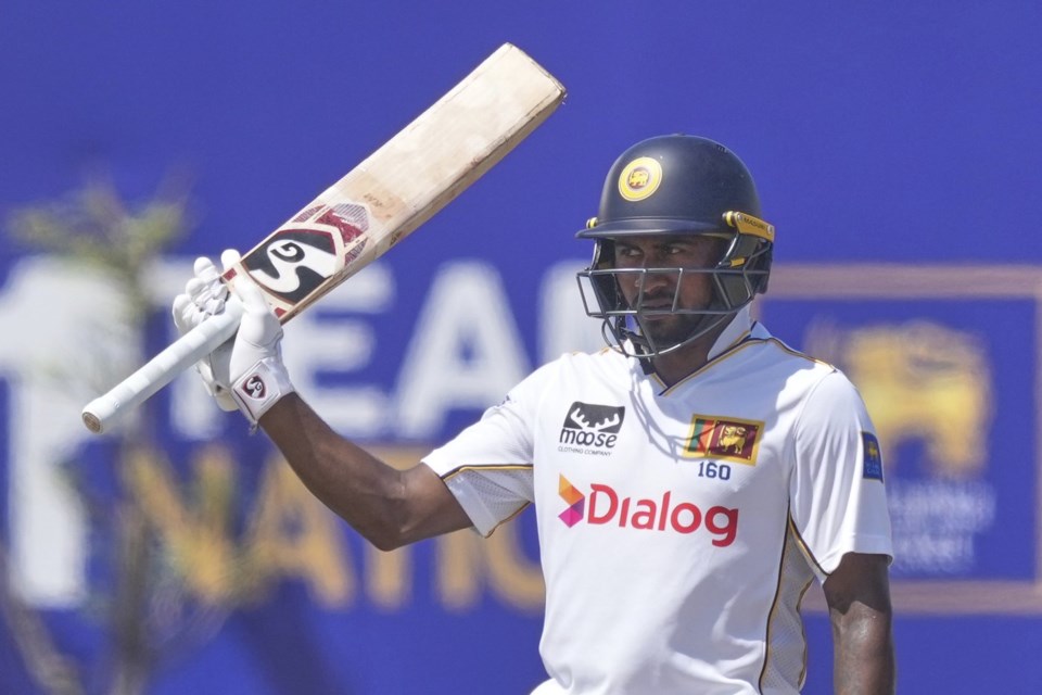 Sri Lanka's Kamindu Mendis celebrates his fifty runs during day four of the first cricket test match between Sri Lanka and Bangladesh in Galle, Sri Lanka, Friday, June 20, 2025. (AP Photo/Eranga Jayawardena)