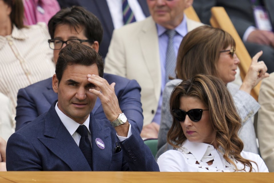 Tennis legend Roger Federer and his wife Mirka sit in the Royal Box on Centre Court on day eight of the Wimbledon Tennis Championships in London, Monday, July 7, 2025. (AP Photo/Kin Cheung)