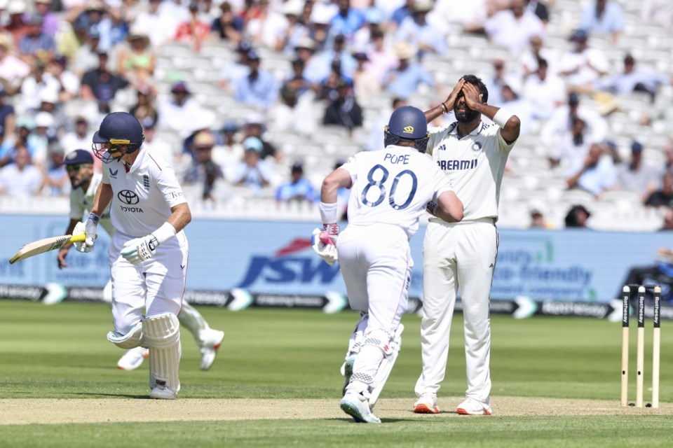 India's Jasprit Bumrah reacts as England's Ollie Pope, middle, and England's Joe Root run between the wickets to score during the third cricket test match between England and India at Lord's cricket ground in London, Thursday, July 10, 2025. (AP Photo/Richard Pelham)