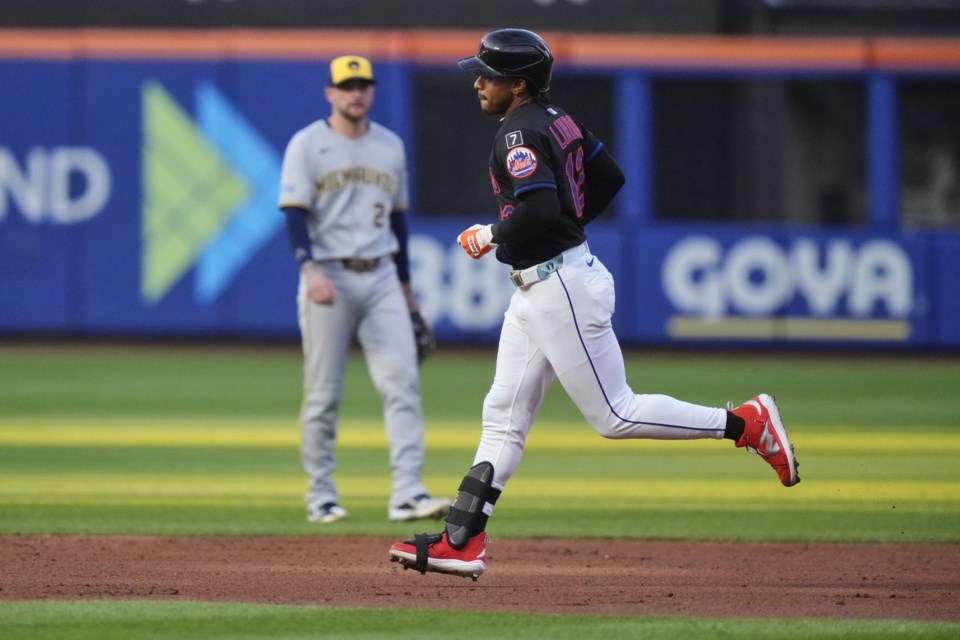 New York Mets' Francisco Lindor (12) runs the bases after hitting a home run during the second inning in the second baseball game of a doubleheader against the Milwaukee Brewers Wednesday, July 2, 2025, in New York. (AP Photo/Frank Franklin II)