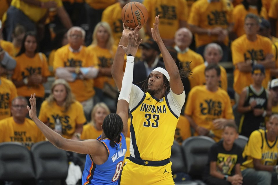 FILE - Indiana Pacers center Myles Turner (33) shoots over Oklahoma City Thunder forward Jalen Williams (8) during the second half of Game 6 of the NBA Finals basketball series, June 19, 2025, in Indianapolis. (AP Photo/Michael Conroy, File)