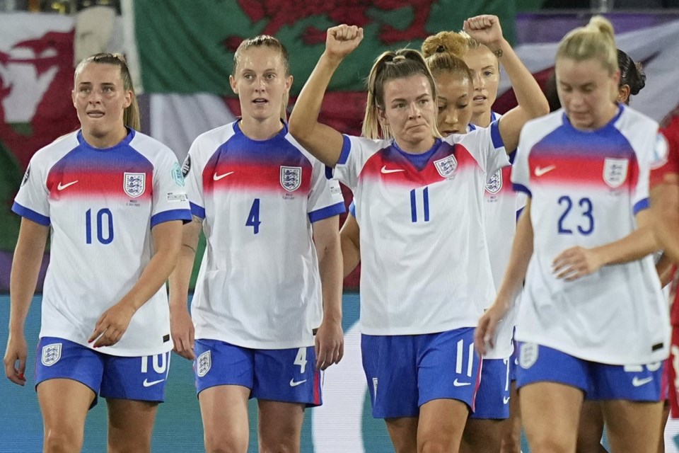 England's Lauren Hemp, center, celebrates with teammates after scoring her sides third goal during the Women's Euro 2025, group D, soccer match between England and Wales at Arena St. Gallen in St. Gallen, Switzerland, Sunday, July 13, 2025. (AP Photo/Martin Meissner)