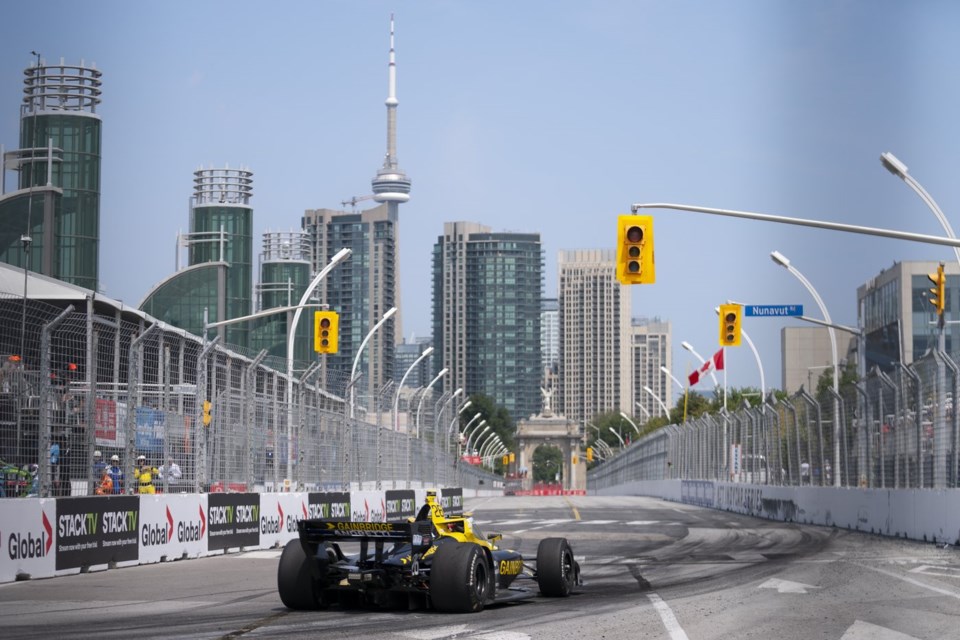 Winner Colton Herta (26) of the United States drives during the 2024 Ontario Honda Dealers Indy in Toronto on Sunday, July 21, 2024. THE CANADIAN PRESS/Arlyn McAdorey
