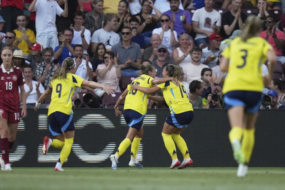 Sweden's Filippa Angeldahl celebrates after scoring her side's first goal during the Euro 2025, group C, soccer match between Denmark and Sweden at Stade de Geneve in Geneva, Switzerland, Friday, July 4, 2025. (AP Photo/Alessandra Tarantino)