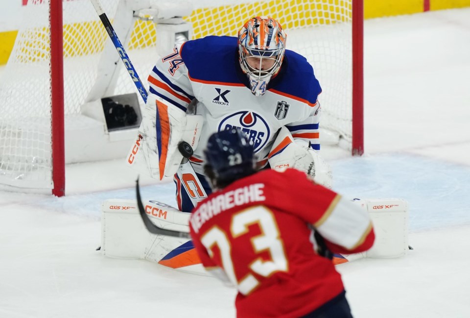 Edmonton Oilers goalie Stuart Skinner (74) makes a save on Florida Panthers' Carter Verhaeghe (23) during the third period in Game 6 of the Stanley Cup final in Sunrise, Fla., on Tuesday, June 17, 2025. THE CANADIAN PRESS/Nathan Denette