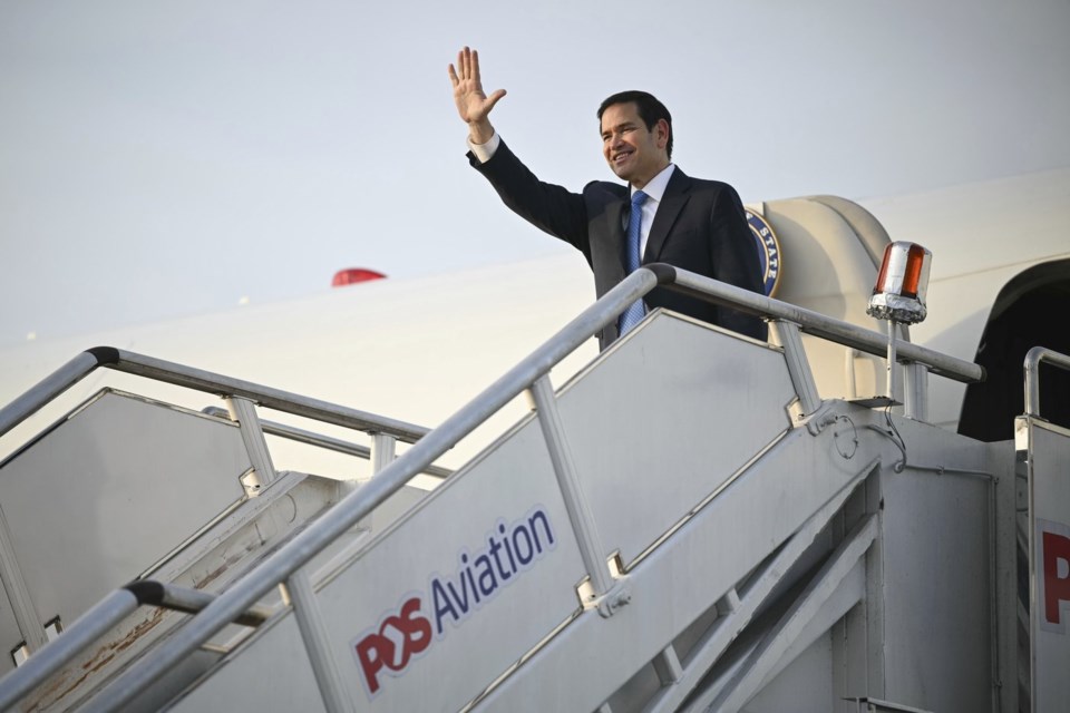 US Secretary of State Marco Rubio gestures as he boards his flight before departing from Subang Air Base, on the outskirts of Kuala Lumpur, on Friday, July 11, 2025, after attending the 58th ASEAN Foreign Ministers' meeting. (Mandel Ngan/Pool Photo via AP)