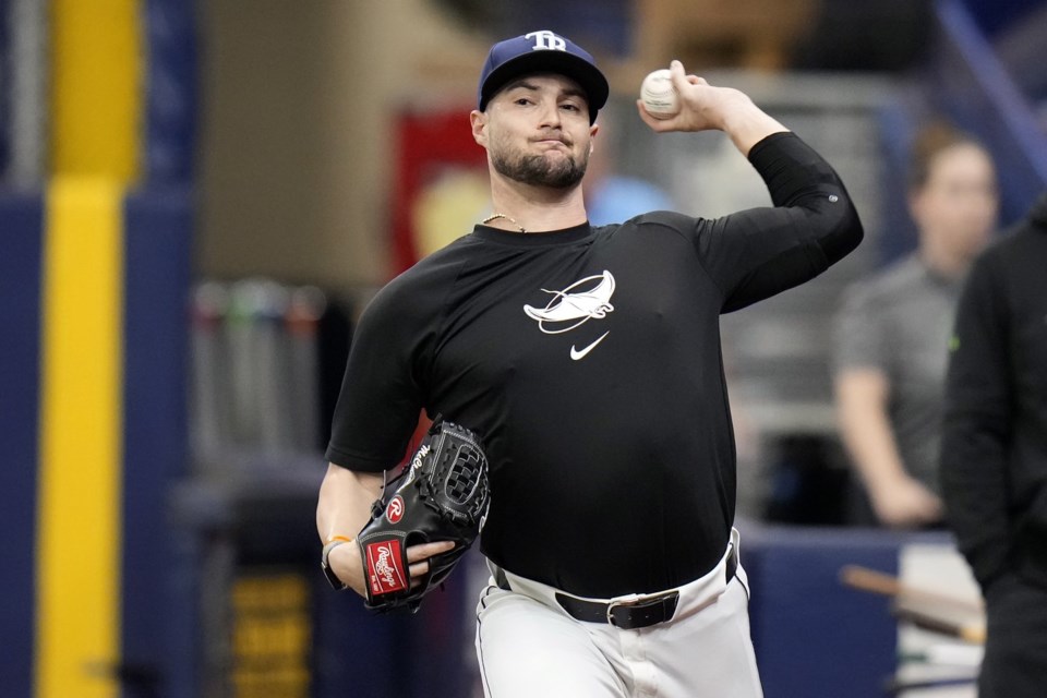 FILE - Tampa Bay Rays pitcher Shane McClanahan throws in the bullpen before a baseball game between the Rays and the Baltimore Orioles on Aug. 10, 2024, in St. Petersburg, Fla. (AP Photo/Chris O'Meara, File)