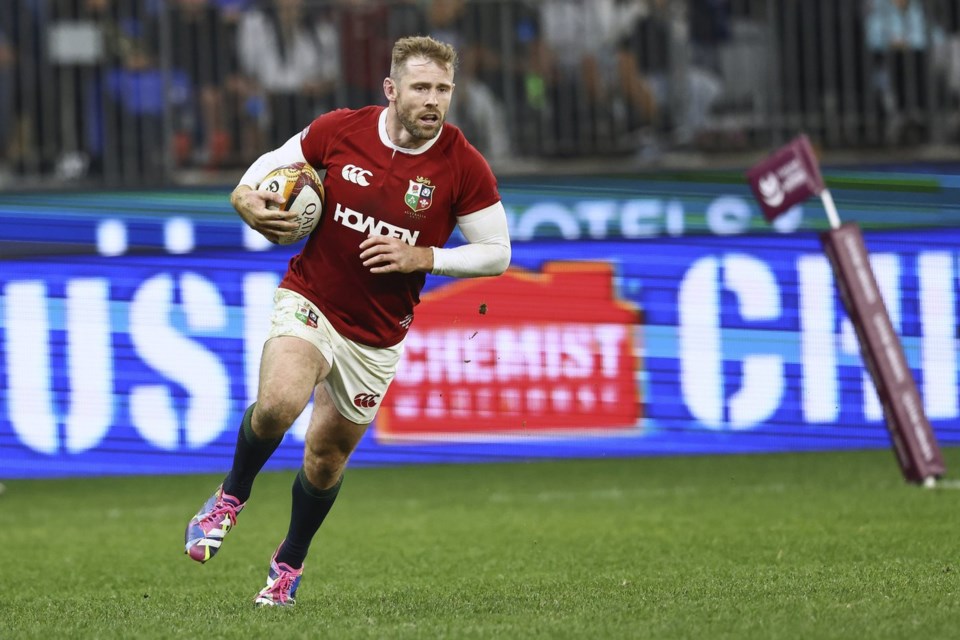 Elliot Daly of the British & Irish Lions runs to score a try during their rugby match against the Western Force in Perth, Australia, Saturday, June 28, 2025. (AP Photo/Trevor Collens)
