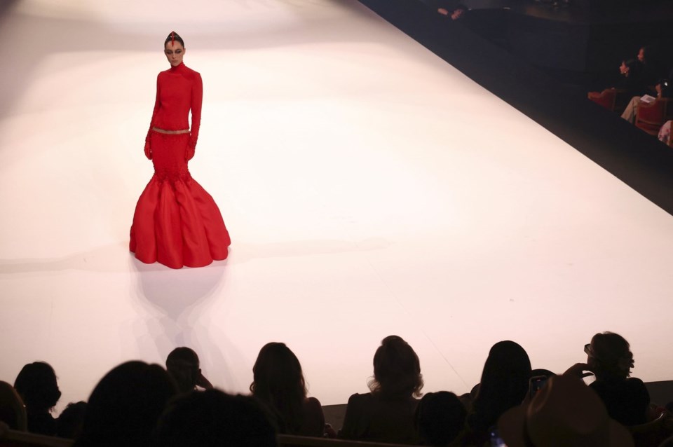 A model wears a creation as part of the Stephane Rolland Fall-Winter 2025/26 Haute Couture collection presented Tuesday, July 8, 2025, in Paris. (AP Photo/Tom Nicholson)