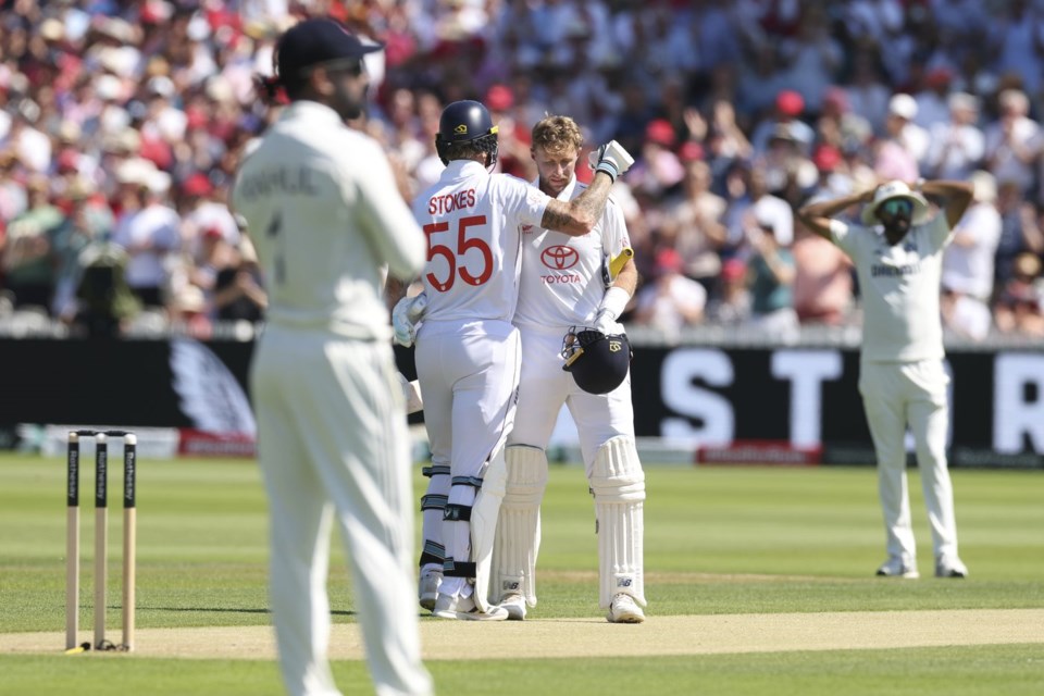England's captain Ben Stokes, second left, congratulates Joe Root after scoring a century during the third cricket test match between England and India at Lord's cricket ground in London, Friday, July 11, 2025. (AP Photo/Richard Pelham)