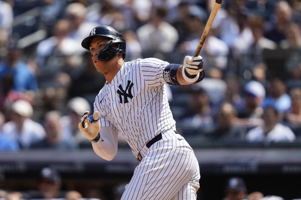 New York Yankees' Aaron Judge (99) hits a double during the seventh inning of a baseball game against the Chicago Cubs, Saturday, July 12, 2025, in New York. (AP Photo/Yuki Iwamura)