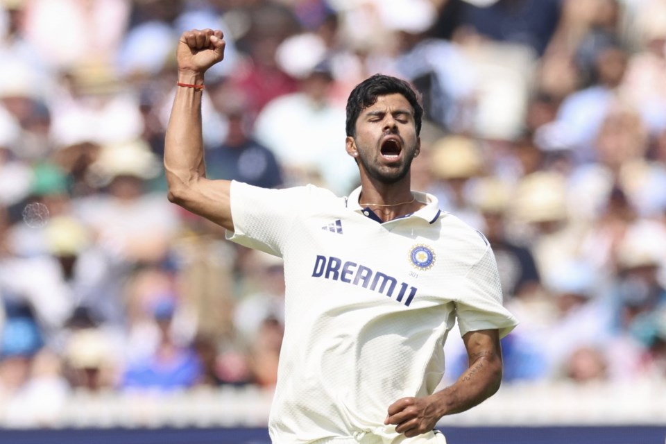India's Washington Sundar celebrates the dismissal of England's Joe Root during the fourth day of the third cricket test match between England and India at Lord's cricket ground in London, Sunday, July 13, 2025.(AP Photo/Richard Pelham)