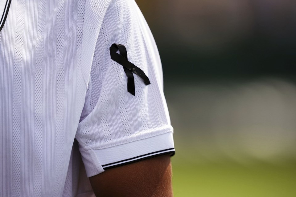 Francisco Cabral of Portugal, wearing a black ribbon in memory of compatriot and soccer player Diogo Jota, on day five of the Wimbledon Championships in, London, Friday July 4, 2025. (Mike Egerton/PA via AP)