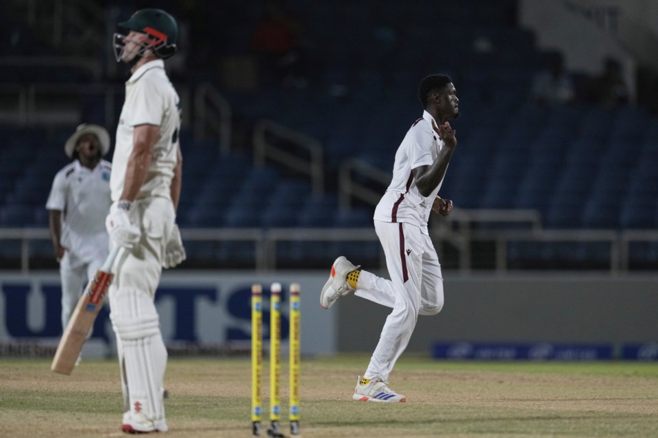 West Indies' Alzarri Joseph celebrates taking the wicket of Australia's Beau Webster on day two of the third Test cricket match at Sabina Park in Kingston, Jamaica, Sunday, July 13, 2025. (AP Photo/Ricardo Mazalan)