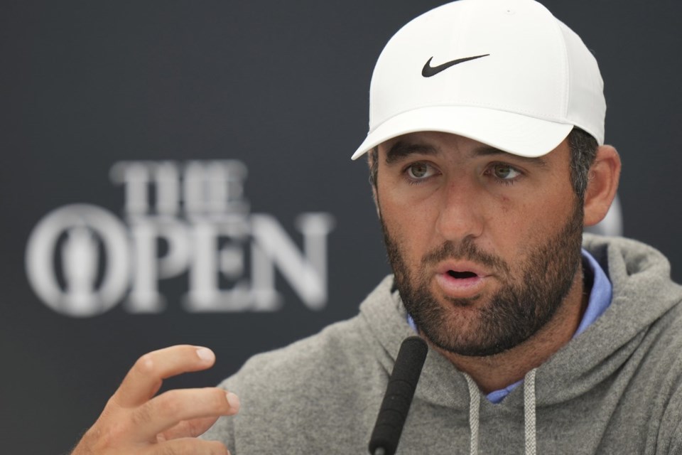 Scottie Scheffler of the United States gestures as he speaks during press conference ahead of the British Open golf championship at the Royal Portrush Golf Club, Northern Ireland, Tuesday, July 15, 2025. The Open starts Thursday. (AP Photo/Francisco Seco)