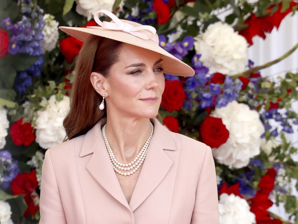 Britain's Kate, Princess of Wales awaits the arrival of France's President Emmanuel Macron and his wife Brigitte Macron in Windsor, England, Tuesday July 8, 2025, on the first day of a three-day state visit to Britain. (Chris Jackson/Pool via AP)