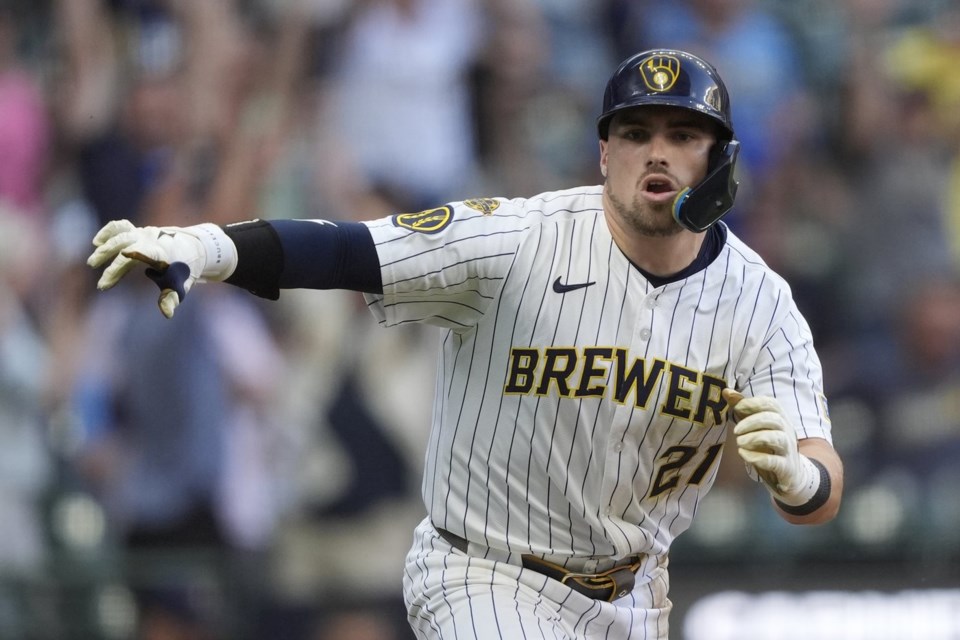 Milwaukee Brewers' Caleb Durbin gestures after hitting a walkoff single during the ninth inning of a baseball game against the Washington Nationals, Saturday, July 12, 2025, in Milwaukee. (AP Photo/Aaron Gash)