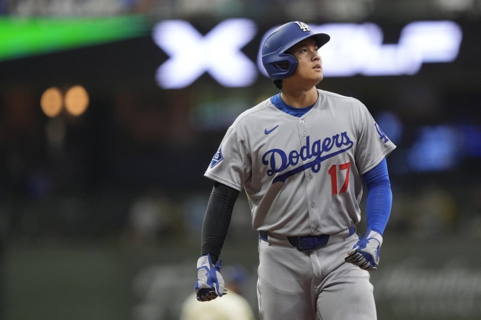 Los Angeles Dodgers' Shohei Ohtani looks on during the eighth inning of a baseball game against the Milwaukee Brewers, Monday, July 7, 2025, in Milwaukee. (AP Photo/Aaron Gash)