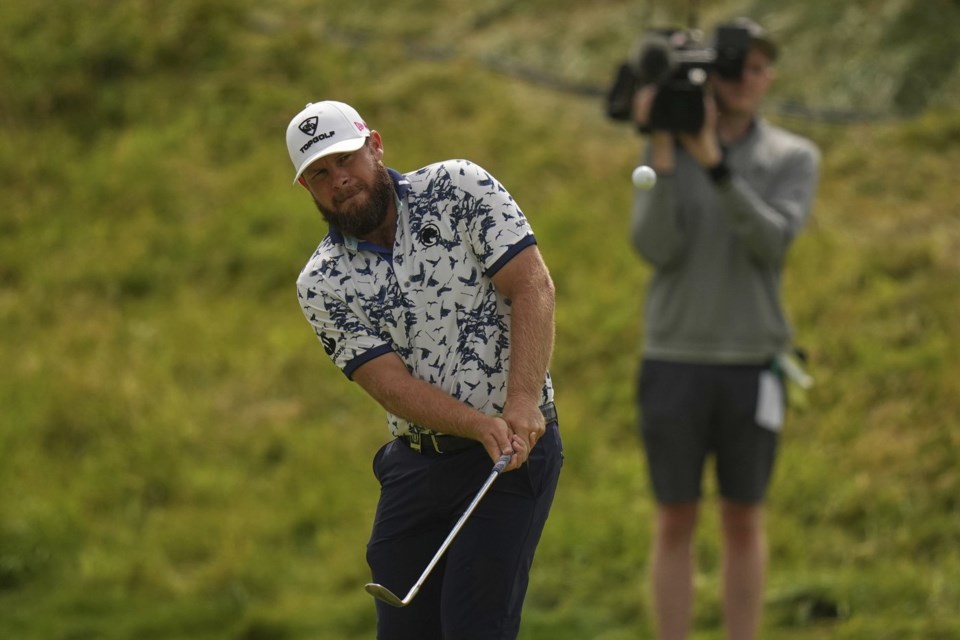 Tyrrell Hatton of England chips onto the 7th green during the second round of the British Open golf championship at the Royal Portrush Golf Club, Northern Ireland, Friday, July 18, 2025. (AP Photo/Francisco Seco)