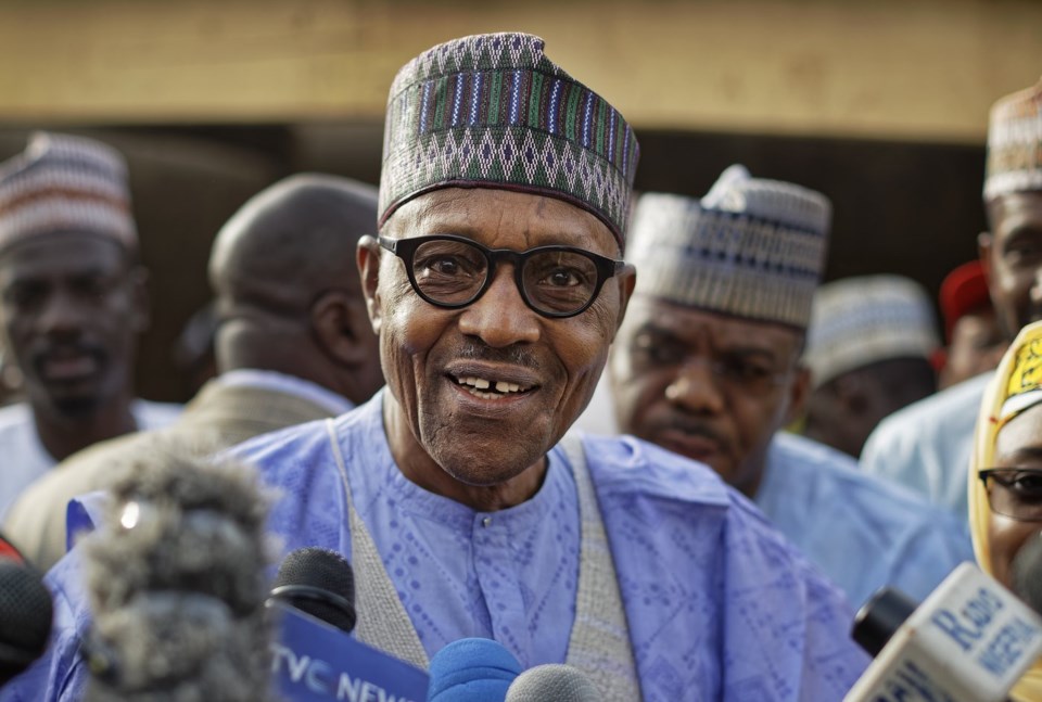 FILE - Nigeria's President Muhammadu Buhari speaks to the media after casting his vote in his hometown of Daura, in northern Nigeria, Saturday, Feb. 23, 2019. (AP Photo/Ben Curtis, File)