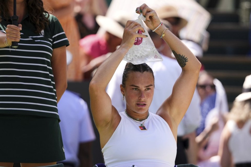 Aryna Sabalenka of Belarus is using an icepack to cool during the women's singles semifinal match against Amanda Anisimova of the U.S. at the Wimbledon Tennis Championships in London, Thursday, July 10, 2025.(AP Photo/Kirsty Wigglesworth)