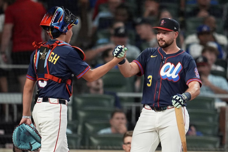 Seattle Mariners' Cal Raleigh greets his brother Todd Jr. during the MLB baseball All-Star Home Run Derby, Monday, July 14, 2025, in Atlanta. (AP Photo/Mike Stewart)
