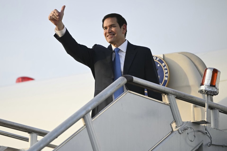 US Secretary of State Marco Rubio gestures as he boards his flight before departing from Subang Air Base, on the outskirts of Kuala Lumpur, on Friday, July 11, 2025, after attending the 58th ASEAN Foreign Ministers' meeting. (Mandel Ngan/Pool Photo via AP)