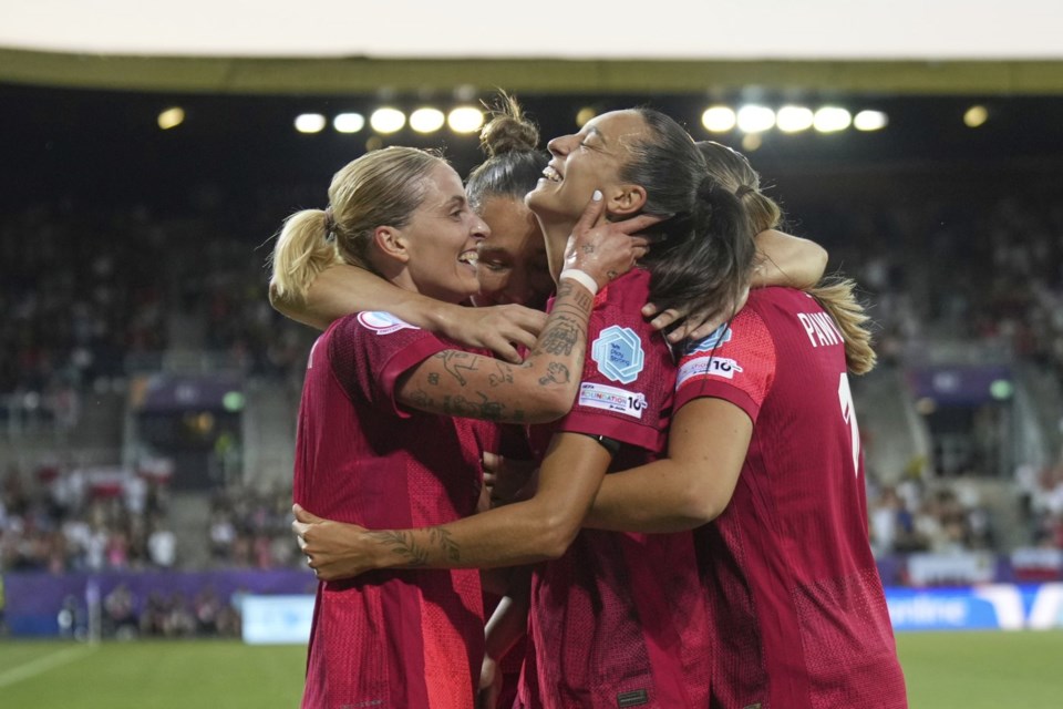 Poland's Natalia Padilla, centre, celebrates with teammates after scoring her side's opening goal during the Women's Euro 2025, group C, soccer match between Poland and Denmark at Allmend Stadion Luzern in Lucerne, Switzerland, Saturday, July 12, 2025. (AP Photo/Alessandra Tarantino)