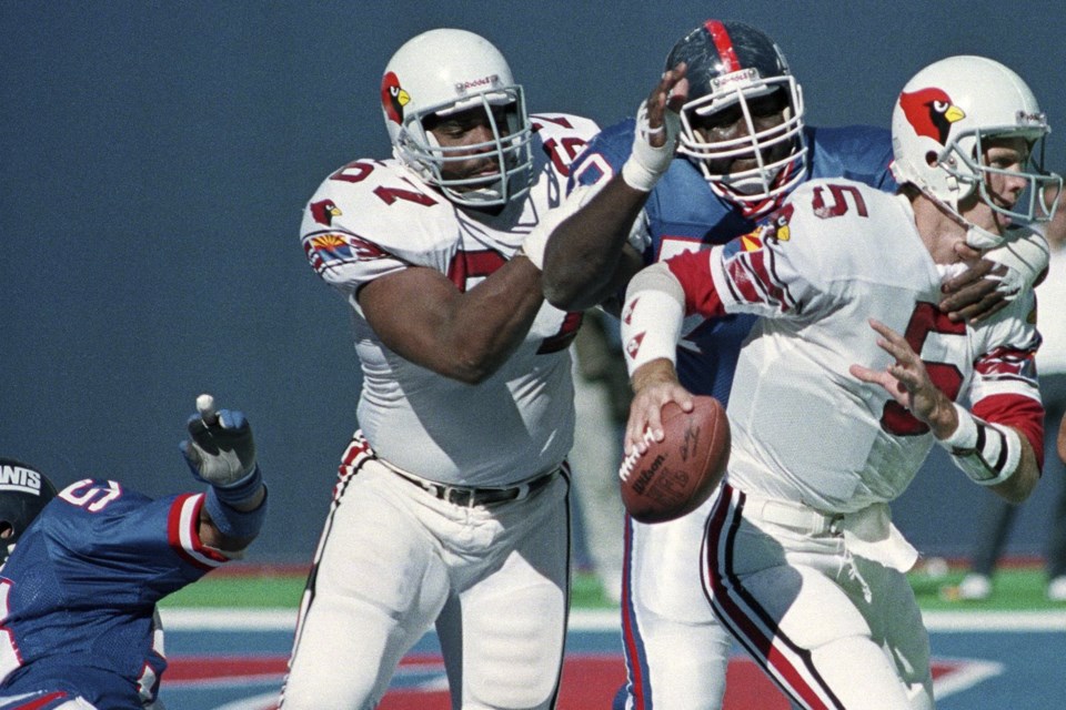 FILE - New York Giants Leonard Marshall cuts in front of the Phoenix Cardinals Luis Sharpe (67) to sack quarterback Gary Hogeboom (5) in the fourth quarter of a football game at Giants Stadium in East Rutherford, N.J., Sept. 25, 1989. (AP Photo/Bill Kostroun, File)