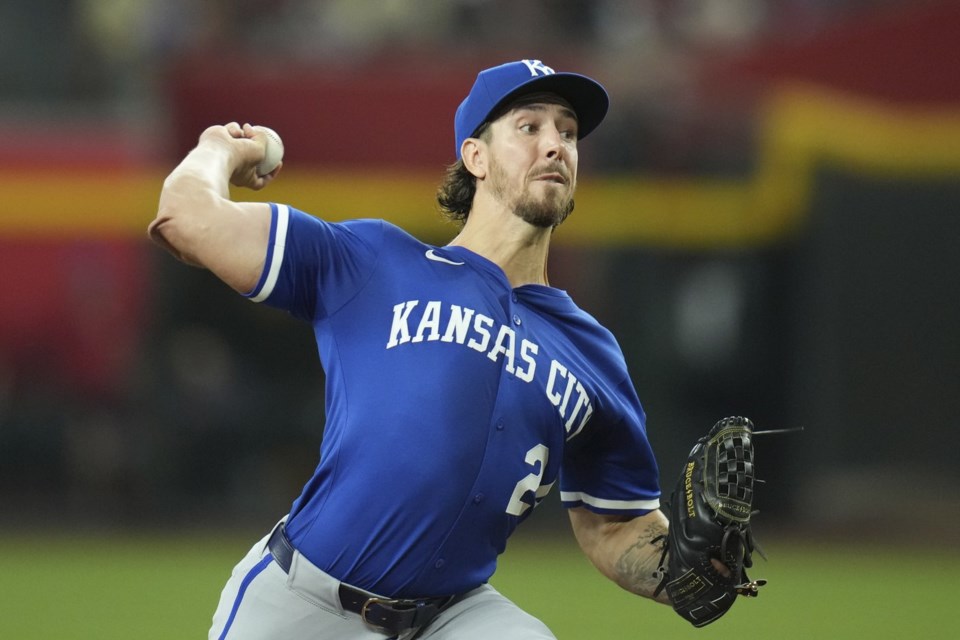 Kansas City Royals starting pitcher Michael Lorenzen throws against the Arizona Diamondbacks during the first inning of a baseball game Sunday, July 6, 2025, in Phoenix. (AP Photo/Ross D. Franklin)