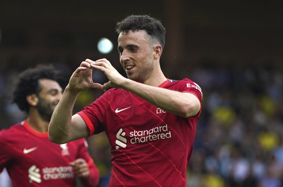 FILE - Liverpool's Diogo Jota celebrates scoring during the Premier League match at Carrow Road, Norwich, Saturday Aug. 14, 2021. (Joe Giddens/PA via AP, File)