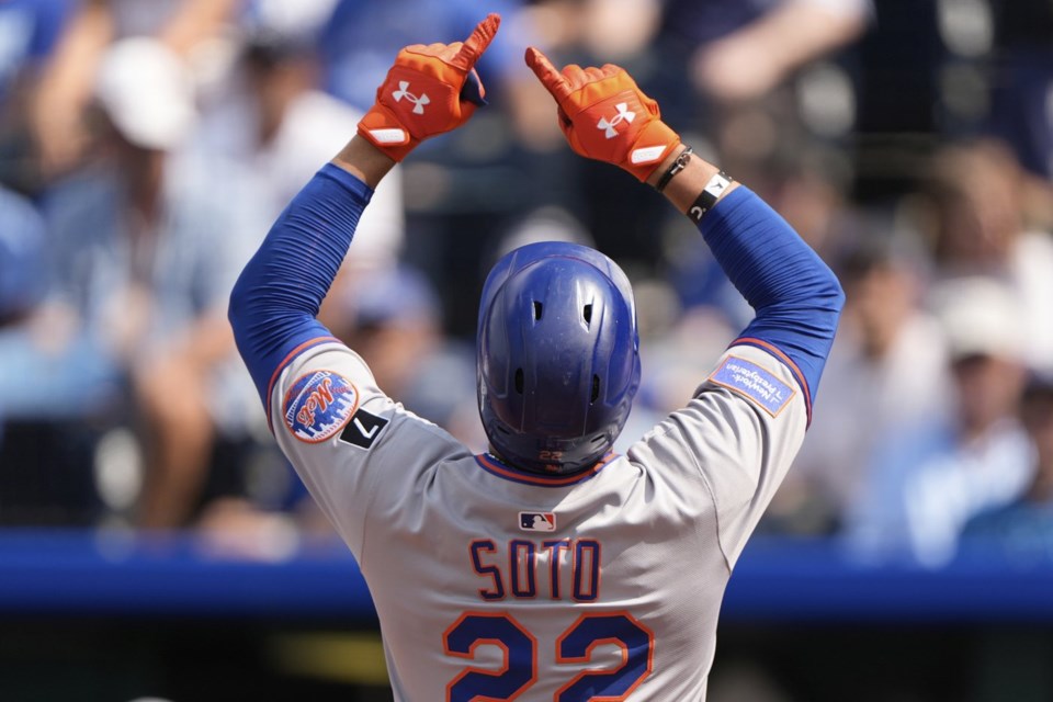 New York Mets' Juan Soto celebrates as he crosses the plate after hitting a two-run home run during the fourth inning of a baseball game against the Kansas City Royals, Saturday, July 12, 2025, in Kansas City, Mo. (AP Photo/Charlie Riedel)