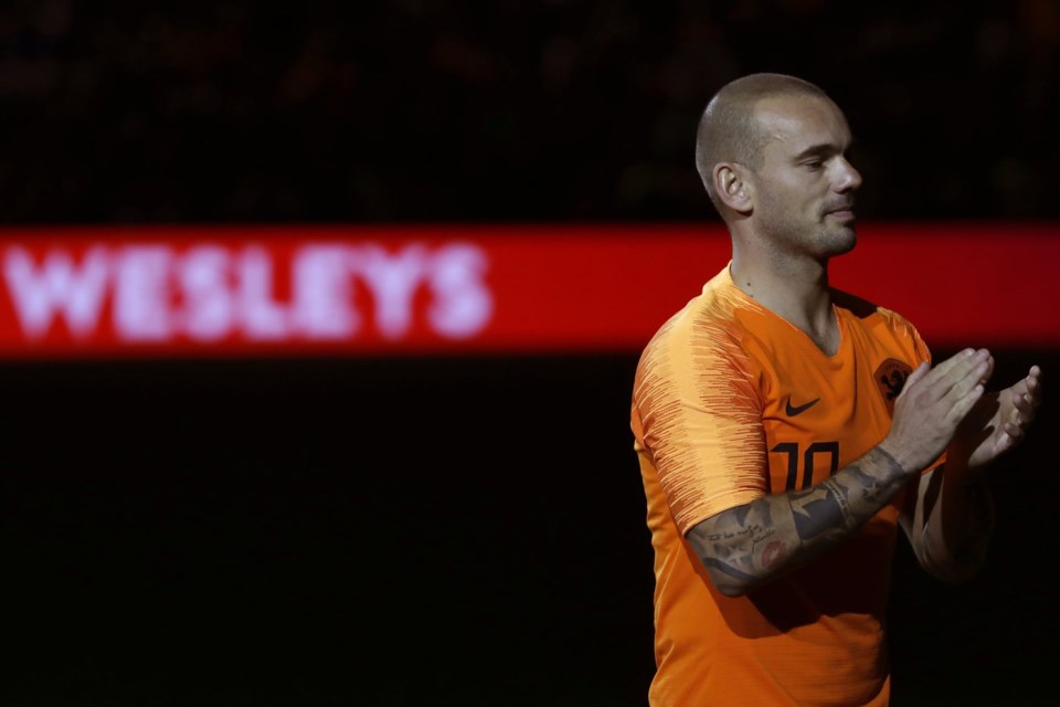 FILE - Wesley Sneijder of The Netherlands greets fans as he walks off the pitch as he retires from international soccer after the international friendly soccer match between The Netherlands and Peru at the Johan Cruijff Arena in Amsterdam, Netherlands, Thursday, Sept. 6, 2018. (AP Photo/Peter Dejong, File)