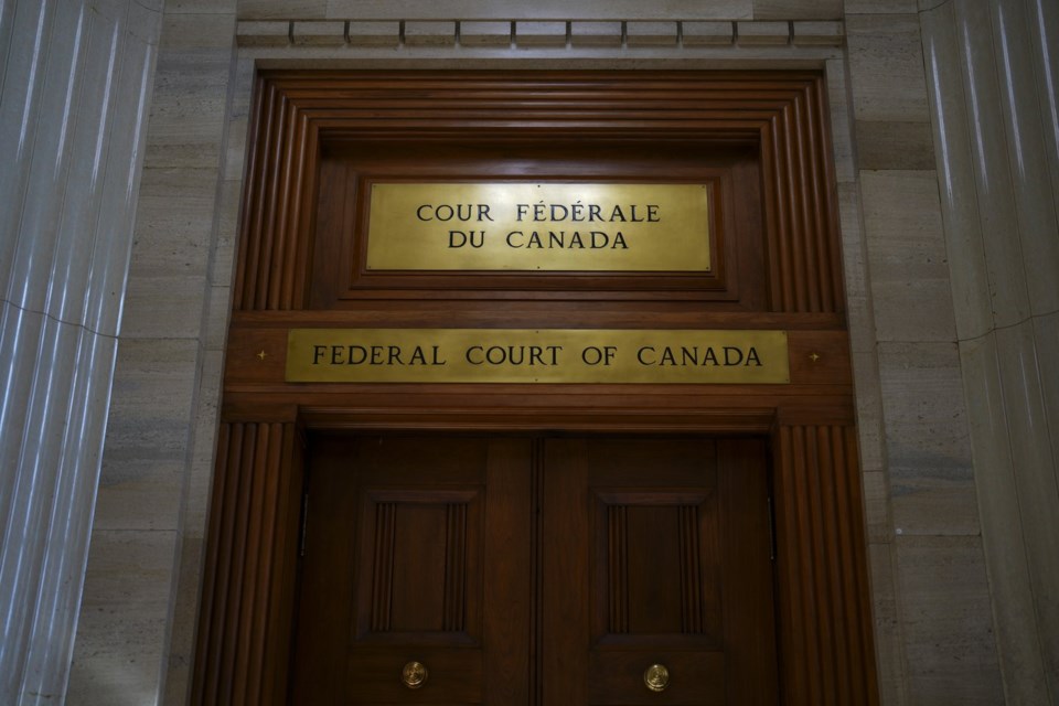 The front doors to the Federal Court of Canada are pictured in Ottawa on Monday, Oct. 23, 2023. THE CANADIAN PRESS/Sean Kilpatrick