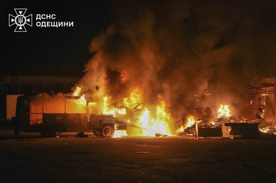 In this photo provided by the Ukrainian Emergency Service, firefighters put out a fire following a Russian attack in Odesa, Ukraine, Monday, July 7, 2025. (Ukrainian Emergency Service via AP)
