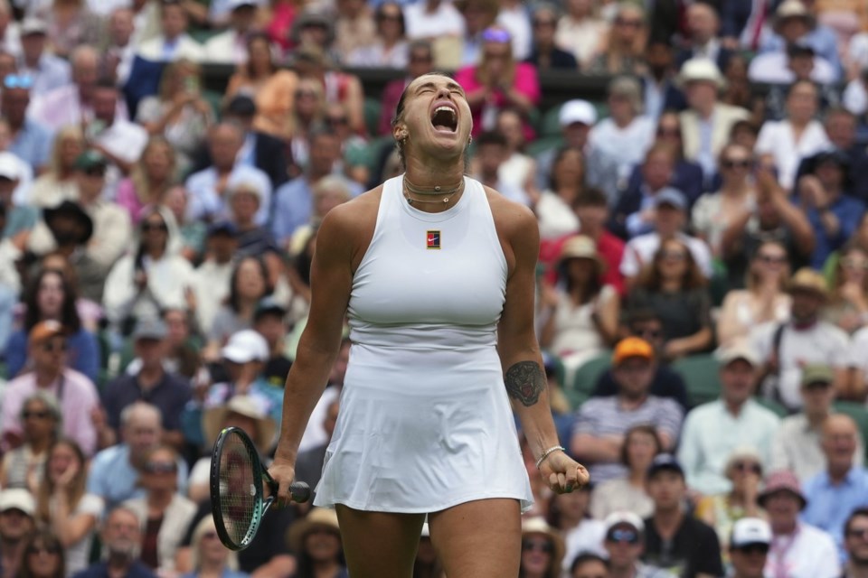 Aryna Sabalenka of Belarus reacts during her second round women's singles match against Marie Bouzkova of the Czech Republic at the Wimbledon Tennis Championships in London, Wednesday, July 2, 2025.(AP Photo/Kirsty Wigglesworth)