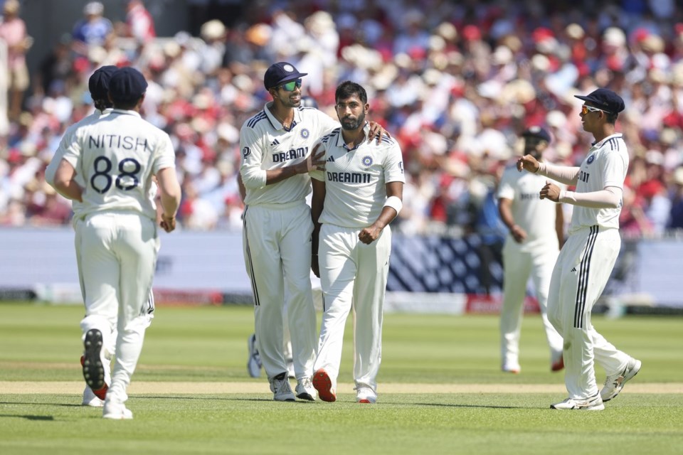 India's Jasprit Bumrah, middle, celebrates with teammates after the dismissal of during the third cricket test match between England and India at Lord's cricket ground in London, Friday, July 11, 2025. (AP Photo/Richard Pelham)