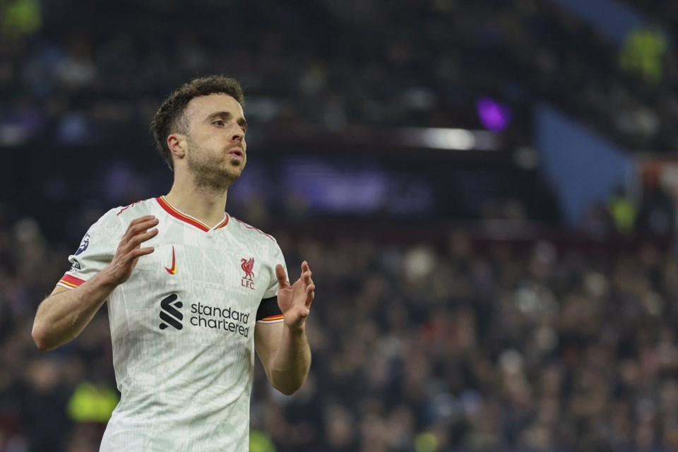 FILE - Liverpool's Diogo Jota reacts after missing a chance to score during the English Premier League soccer match between Aston Villa and Liverpool at Villa Park in Birmingham, England, Wednesday, Feb. 19, 2025. (AP Photo/Darren Staples, File)