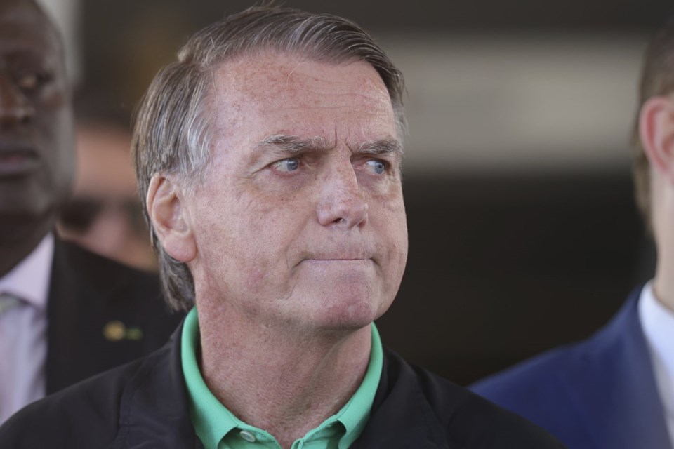 Brazil's former President Jair Bolsonaro gives a press conference outside the Senate in Brasilia, Brazil, Thursday, July 17, 2025. (AP Photo/Luis Nova)