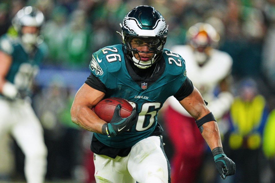 FILE - Philadelphia Eagles running back Saquon Barkley (26) rushes for a touchdown against the Washington Commanders during the second half of the NFC Championship NFL football game, Sunday, Jan. 26, 2025, in Philadelphia. (AP Photo/Derik Hamilton, File)