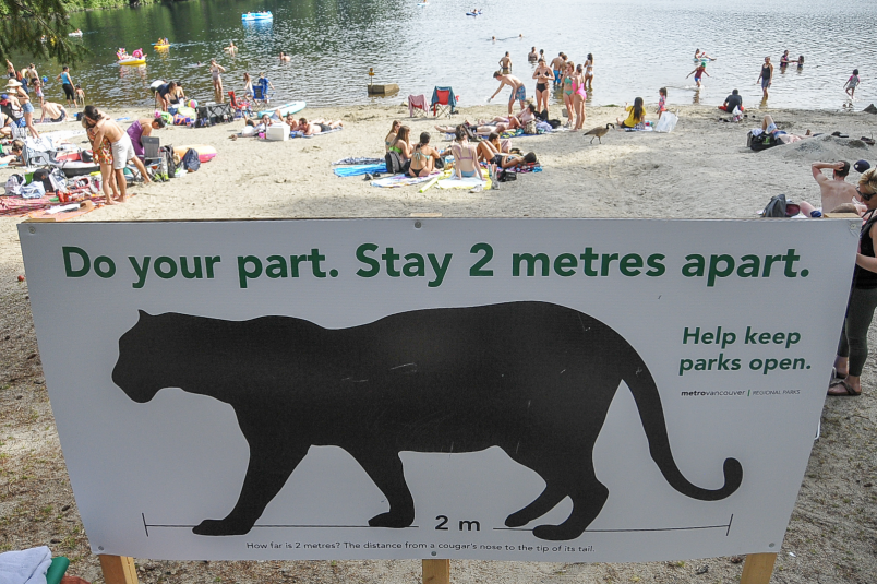 metro-vancouver-sign-reminds-beach-goers-to-maintain-physical-distance-at-belcarra-regional-park-s-w